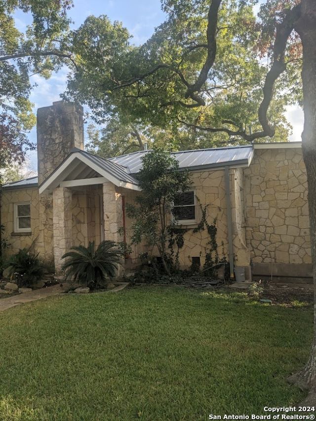 bungalow with a front lawn