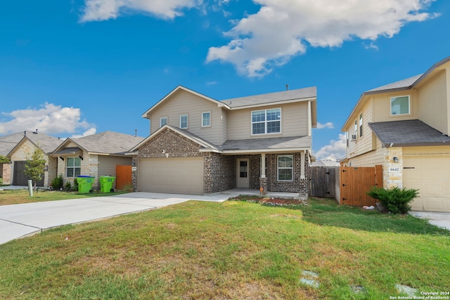 view of front of house featuring a garage and a front yard