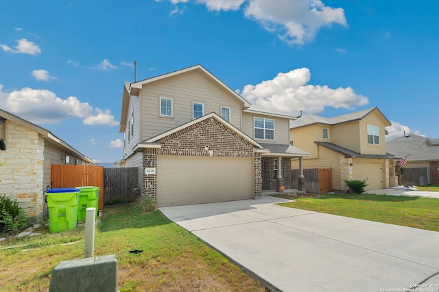 view of front of house featuring a front yard and a garage