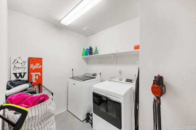 laundry area with independent washer and dryer