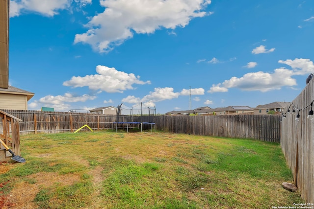 view of yard with a trampoline