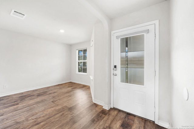 foyer entrance featuring dark wood-type flooring