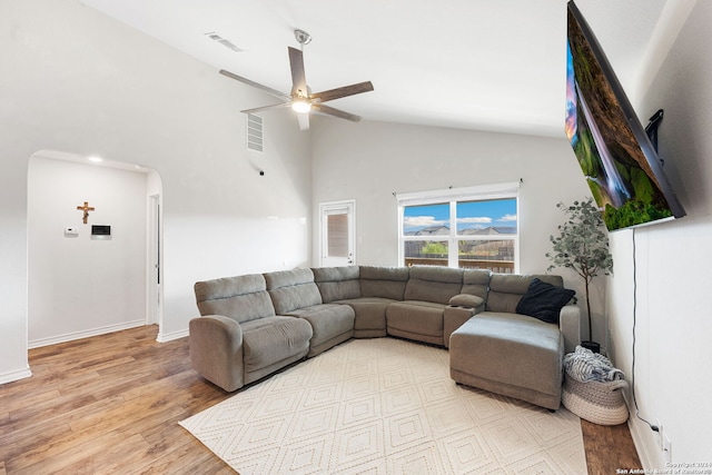 living room featuring light wood-type flooring, lofted ceiling, and ceiling fan