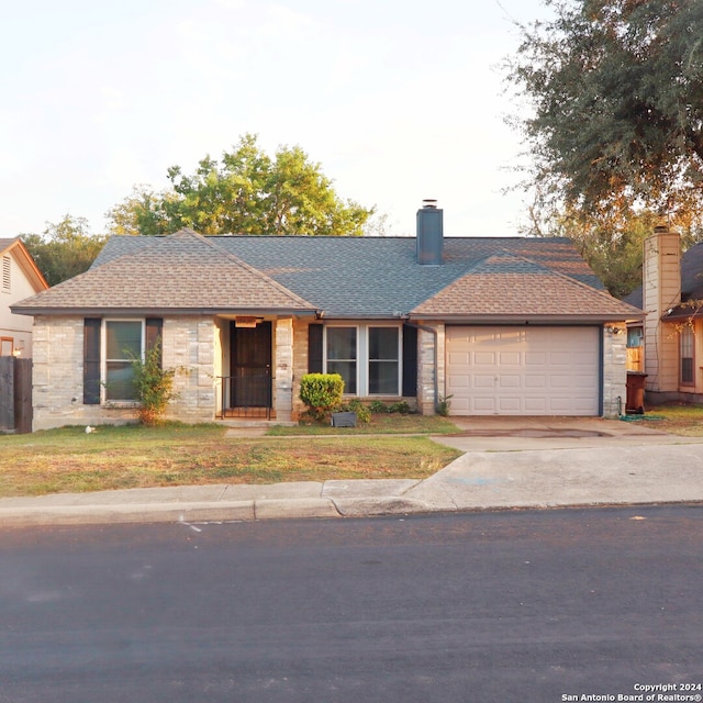 ranch-style home with a garage