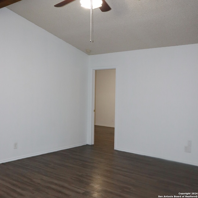 empty room with a textured ceiling, dark hardwood / wood-style floors, and ceiling fan