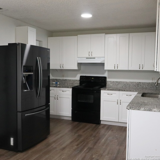 kitchen with white cabinets, dark wood-type flooring, sink, and black appliances