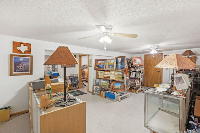 home office featuring a textured ceiling and ceiling fan