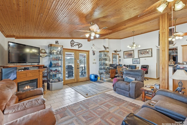 tiled living room featuring ceiling fan with notable chandelier, french doors, wooden ceiling, and vaulted ceiling