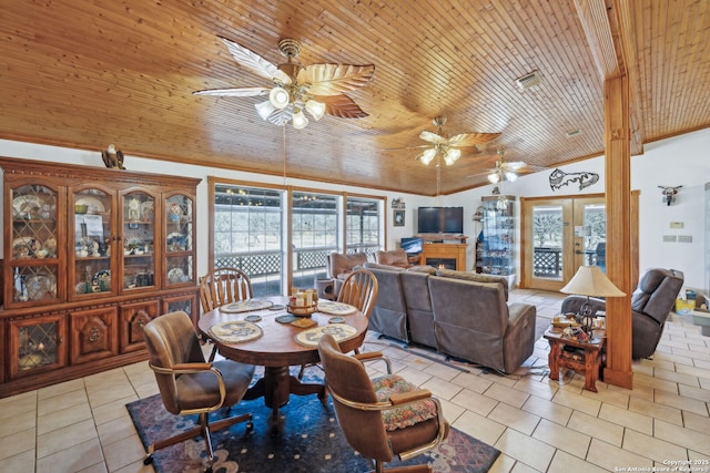 tiled dining area featuring lofted ceiling, wooden ceiling, and ceiling fan