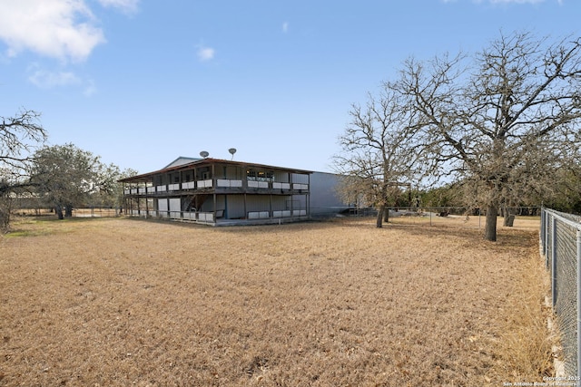 back of property featuring a rural view