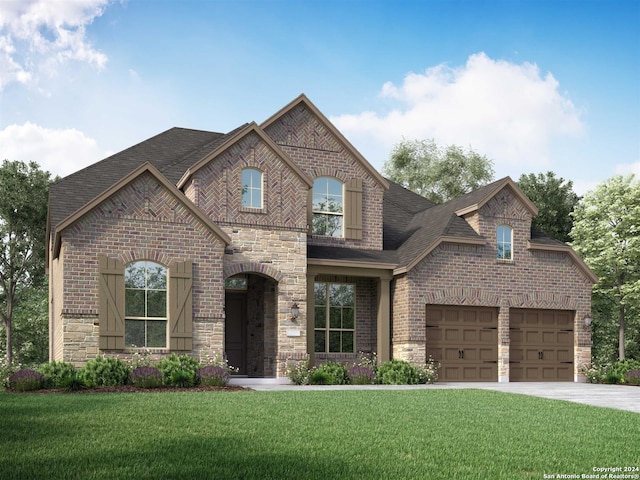 view of front facade with a front yard and a garage