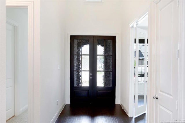 228 Dulce, Boerne, TX 78006 - foyer with french doors, baseboards, and dark wood-type flooring