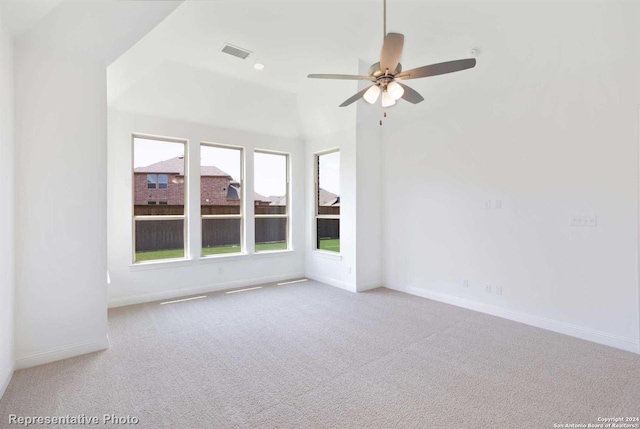 unfurnished room featuring light colored carpet and ceiling fan