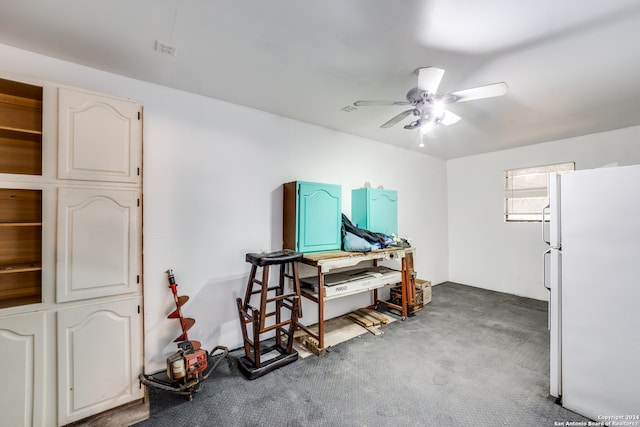 miscellaneous room featuring ceiling fan and carpet floors