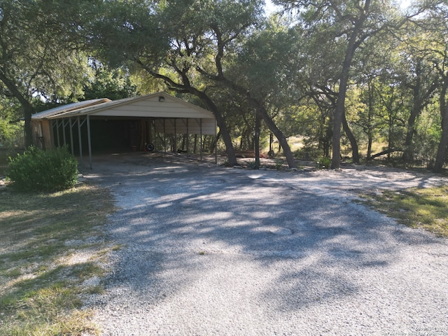 view of side of home featuring a carport