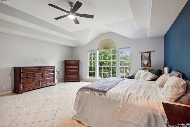 bedroom featuring ceiling fan, light tile patterned flooring, and vaulted ceiling