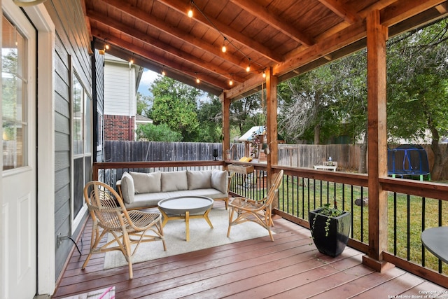 sunroom featuring vaulted ceiling with beams and wooden ceiling