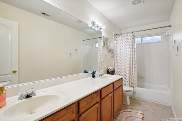 full bathroom with toilet, vanity, tile patterned floors, and shower / bath combo with shower curtain