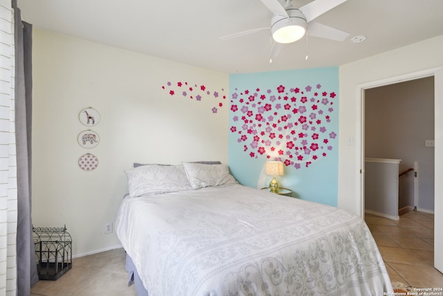 tiled bedroom with ceiling fan