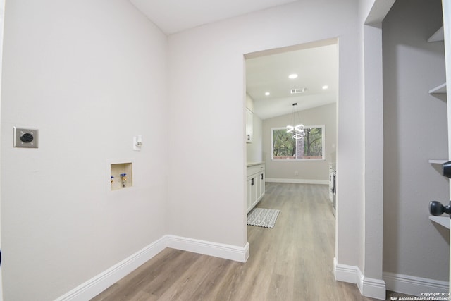 washroom with light wood-type flooring, electric dryer hookup, and washer hookup