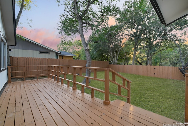 deck at dusk with a yard