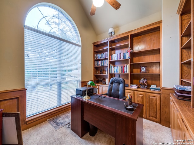 carpeted office featuring ceiling fan and lofted ceiling