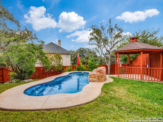 view of swimming pool featuring a lawn, a patio, and a gazebo