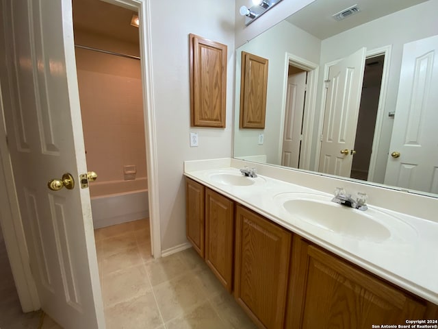 bathroom featuring tile patterned flooring and vanity