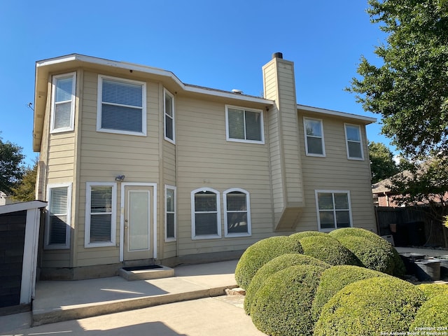 rear view of property with a patio area