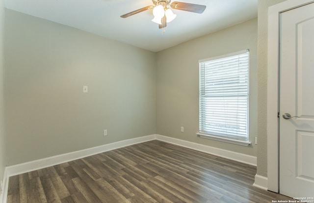 unfurnished room featuring ceiling fan and dark hardwood / wood-style flooring