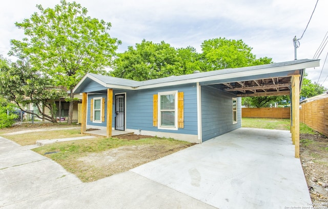 ranch-style home with a carport