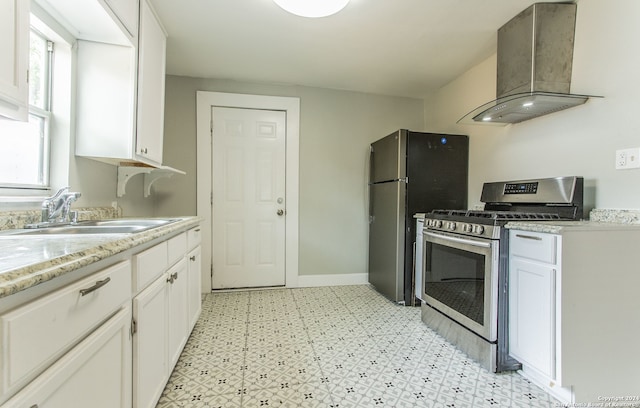 kitchen featuring white cabinetry, appliances with stainless steel finishes, sink, and wall chimney exhaust hood