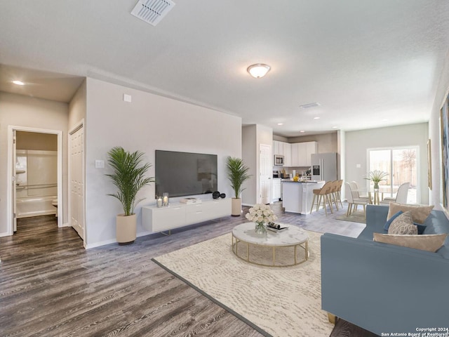 living room featuring dark hardwood / wood-style flooring