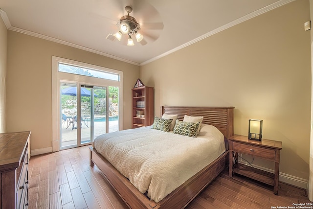 bedroom with hardwood / wood-style floors, crown molding, and access to outside