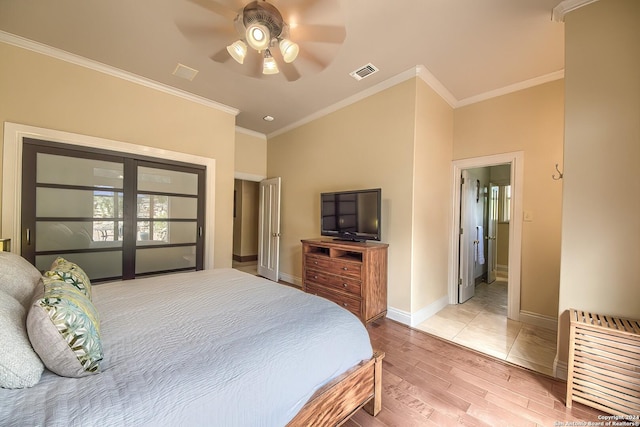 bedroom with crown molding, ceiling fan, and light wood-type flooring