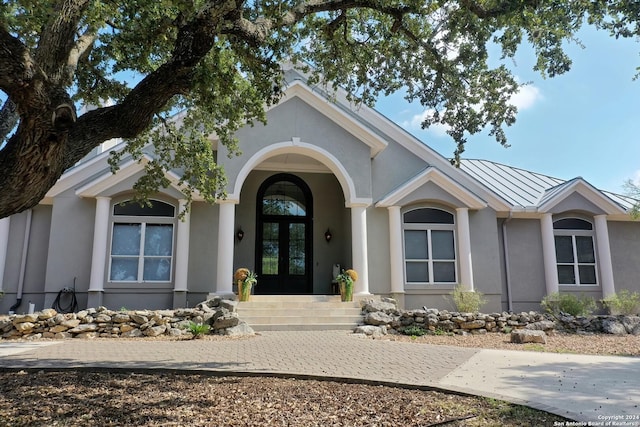 doorway to property featuring french doors