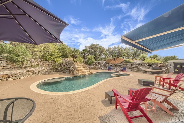 view of swimming pool featuring a patio area