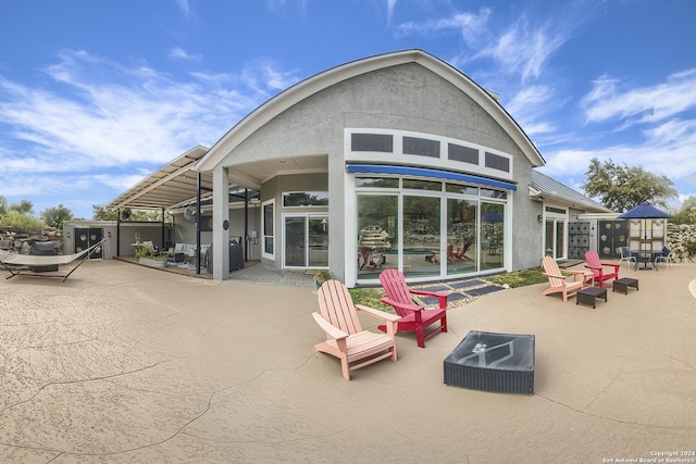 back of house with a patio area