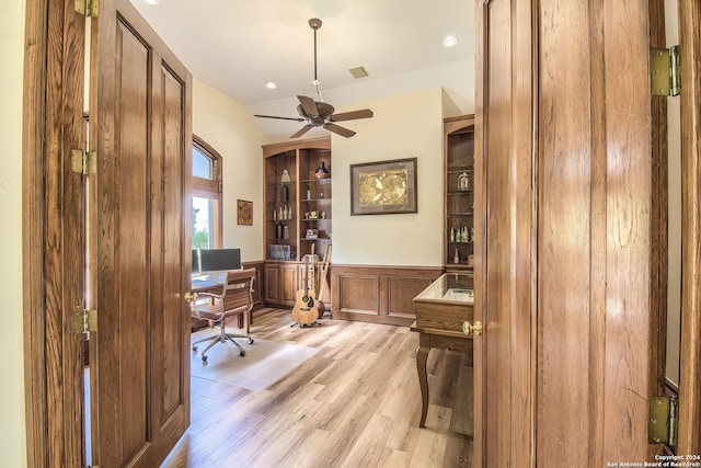 office space with ceiling fan and light hardwood / wood-style flooring