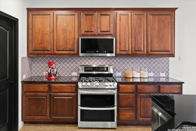 kitchen with stainless steel appliances and tasteful backsplash