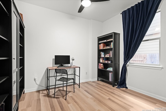 home office featuring hardwood / wood-style flooring and ceiling fan