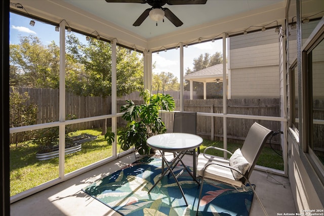 sunroom with plenty of natural light and ceiling fan