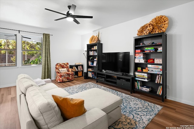 living room with hardwood / wood-style flooring and ceiling fan