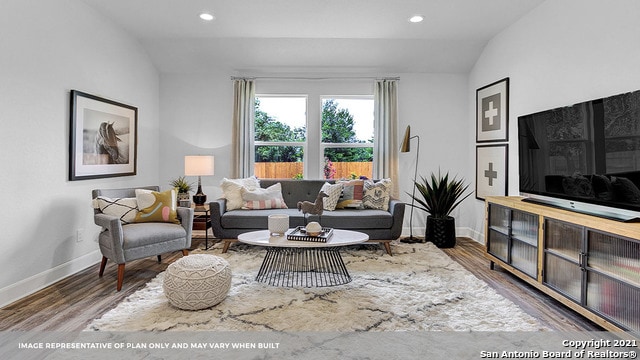 living room with wood-type flooring and lofted ceiling