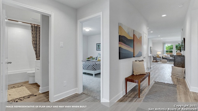 hall with light hardwood / wood-style flooring