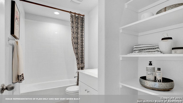 full bathroom featuring toilet, vanity, and shower / bath combo with shower curtain