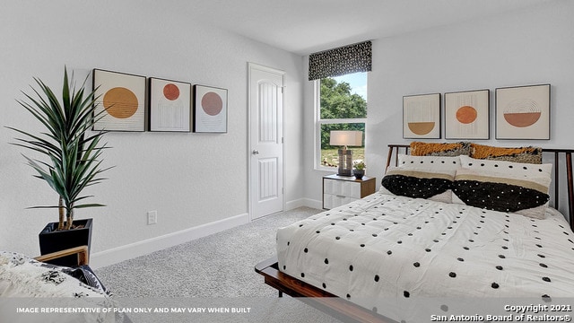 bedroom featuring light colored carpet