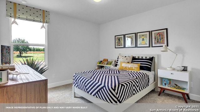 bedroom with light colored carpet