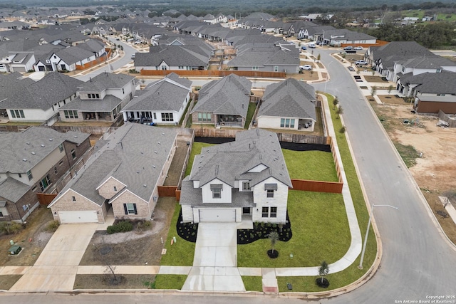 birds eye view of property with a residential view