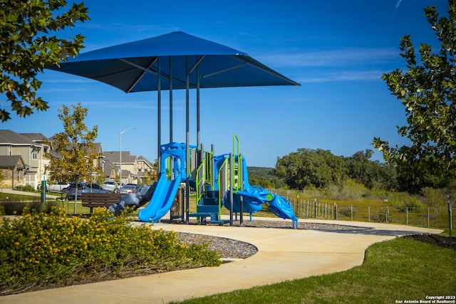 community jungle gym with fence